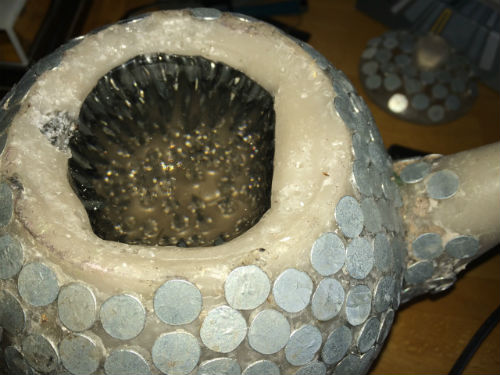 Inside of teapot made with nails
