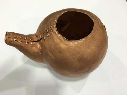 Riveted copper teapot