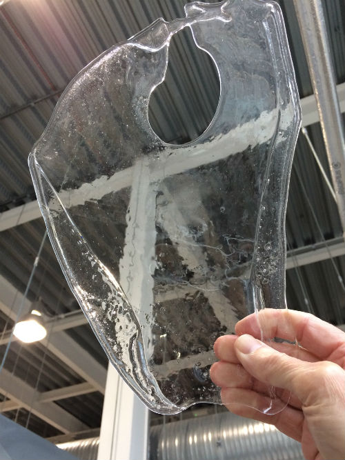Flattened piece of glass bubble