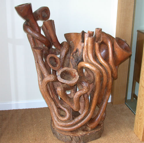 The Music Goes Round and Around, wooden sculpture by Peter Heywood