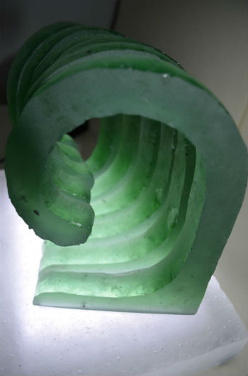 Light bouncing around cast glass wave segments 
