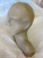 Clay head to make a plaster mould for heads in boxes project by Peter Heywood