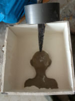 Half way through creating a plaster mould for slip casting heads