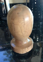 Head made on a lathe from a piece of walnut, as the starting point for a slip-casting mould