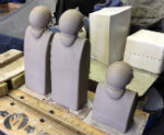 Slip-cast figures drying to leather hard before fettling